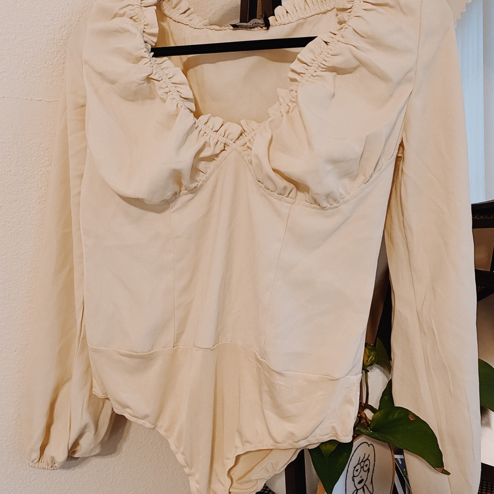 cream blouse body suit